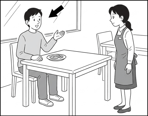 A customer at a restaurant table raising a hand to call a waiter in an apron